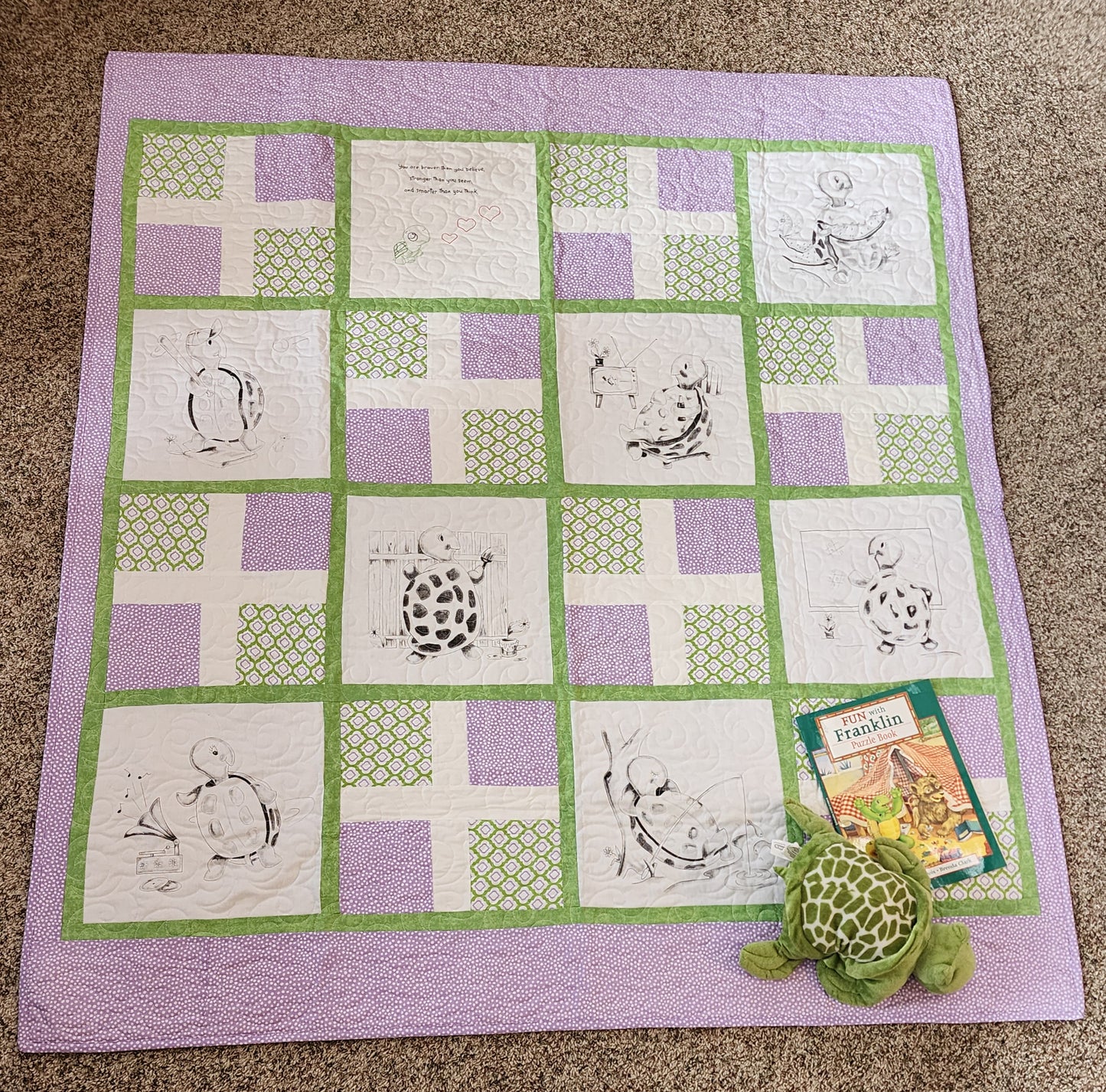Full Purple and green quilt with turtles doing fun activities. The franklin book and a stuff turtle in the corner