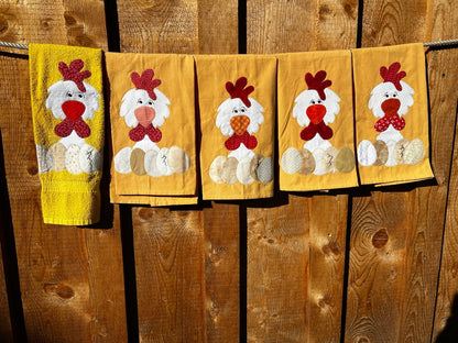 Five Yellow Hand towels all white chickens but there beaks and the four eggs are different colors
