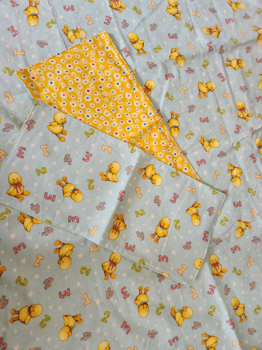 Square Receiving Blanket with Baby ducks and numbers pattern with blue background Fleece. With two burp rags made from the same fabric on top of the blanket