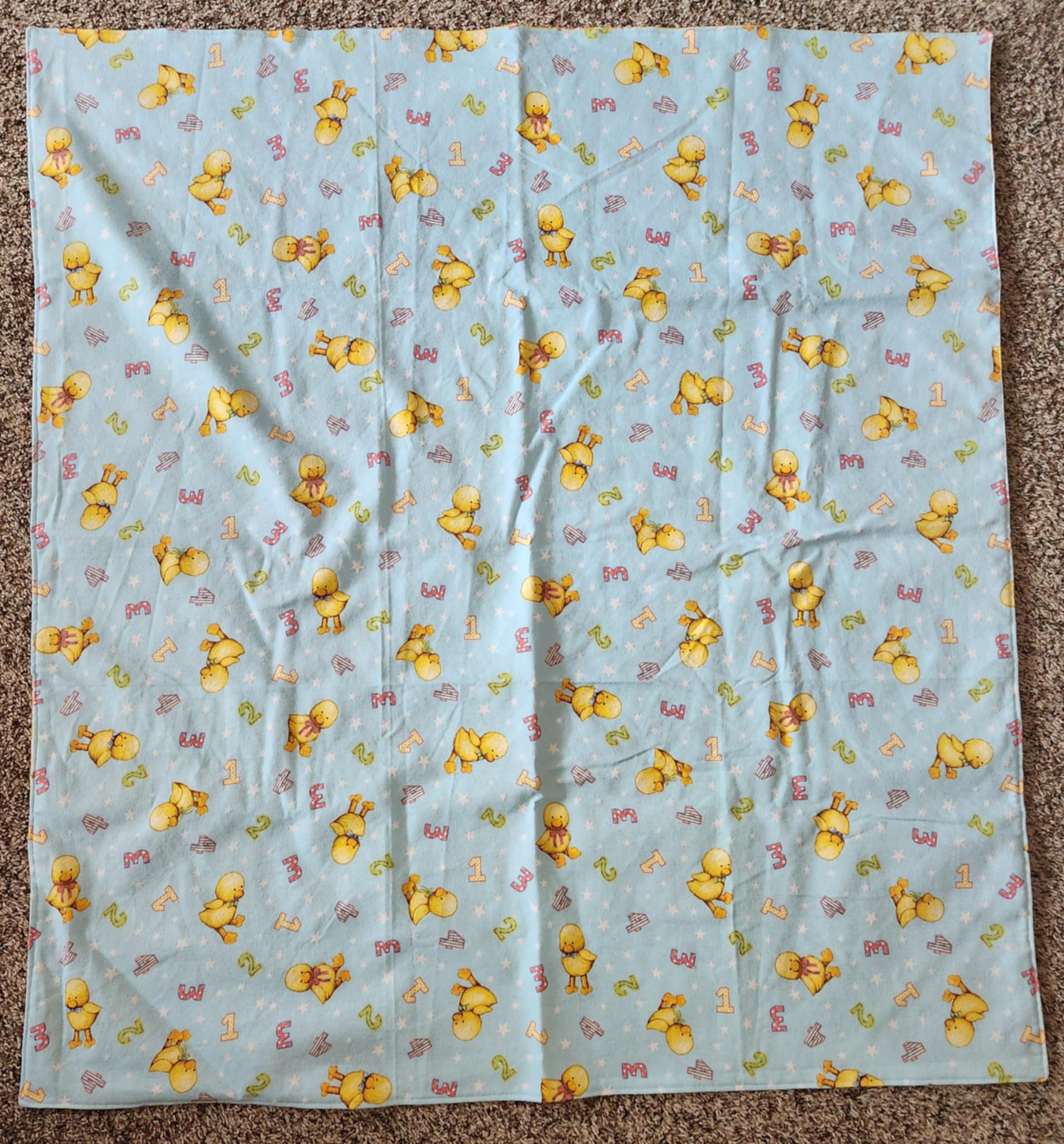 Square Receiving Blanket with Baby ducks and numbers pattern with blue background Fleece.