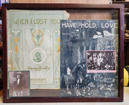 Wood Shadow box with two theater programs. One says When I lost you and the other to have, to hold, to love. A photo of a fancy dressed woman in the bottom corner